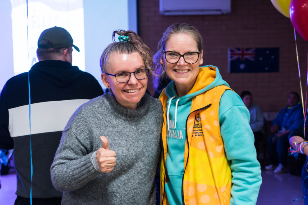 HomePlace participant Kobi is with HomePlace's Chief Executive Julie Bowman as they enjoy Christmas party festivities