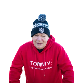 Participant Tommy smiling and wearing a black and white hat and red sweatshirt with the words 'Tommy' written in white.